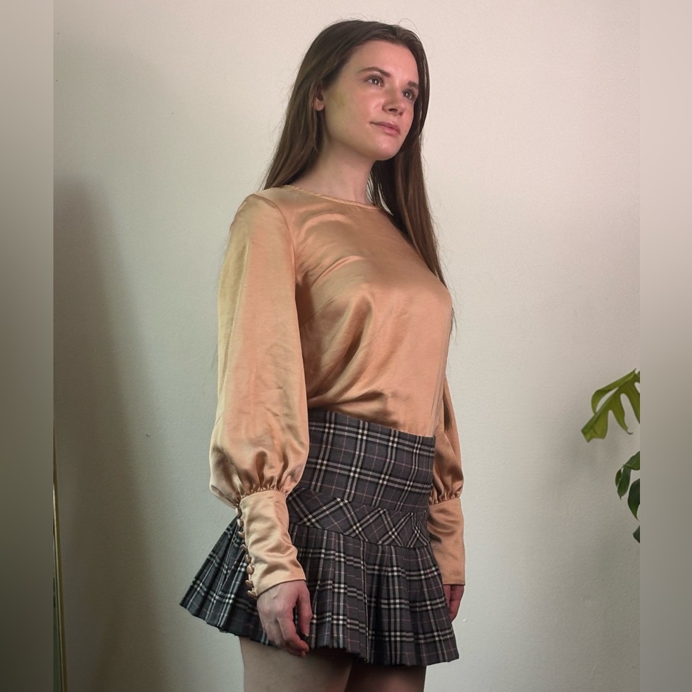 Muted blush pink satin open-back blouse